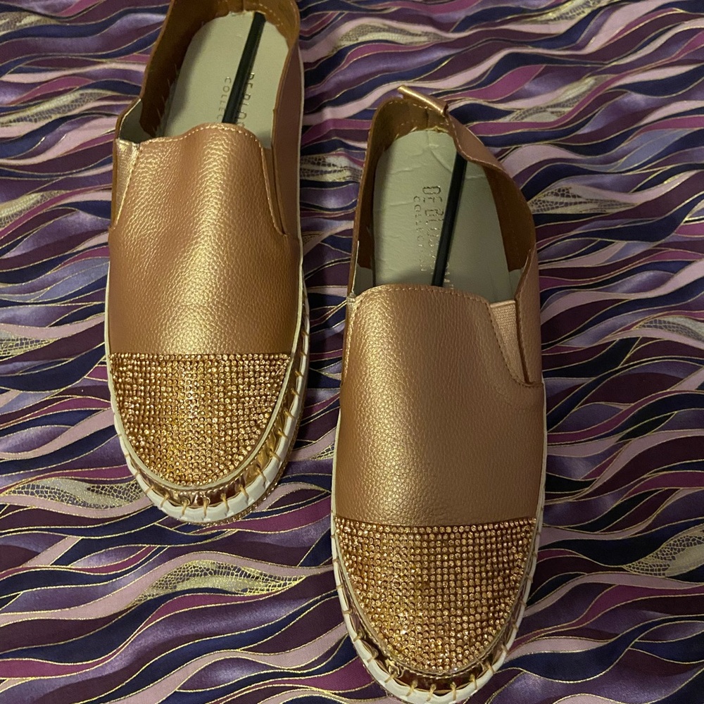 Rose Gold espadrilles with rose gold rhinestones on top and around the sides.